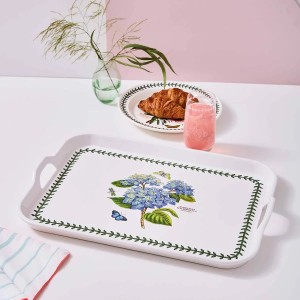 Life style image of Hydrangea blue floral motif for Botanic Garden large handled tray with glass and croissant on table